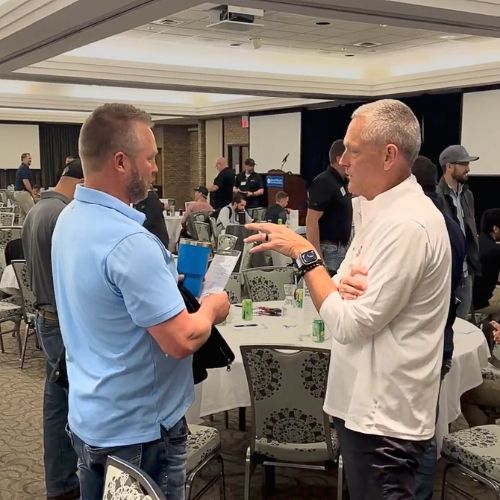 Kyle Pertuis speaking with attendee at Inspired Action Live
